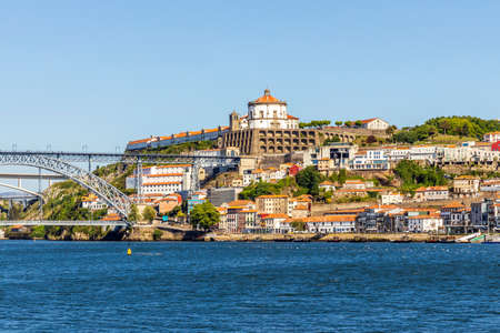 A historic and modern architecture of Vila Nova de Gaia over Douro River, North Region, Portugalの写真素材