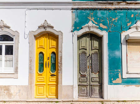 Doors to two different traditional houses - one abandoned and one being renovated in Olhao, Algarve, Portugalの写真素材