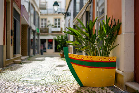 Narrow street of historic fishermen's town called Olhao, Algarve, Portugalの写真素材