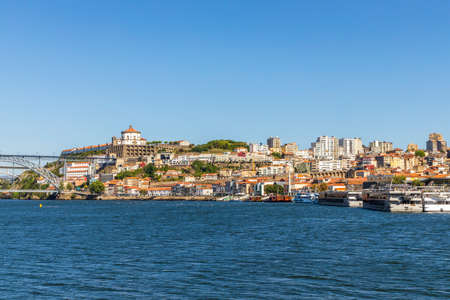 A historic and modern architecture of Vila Nova de Gaia over Douro River, North Region, Portugalの写真素材
