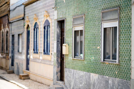 Beautiful houses cover with traditional tiles called azulejo, Olhao, Algarve, Portugal