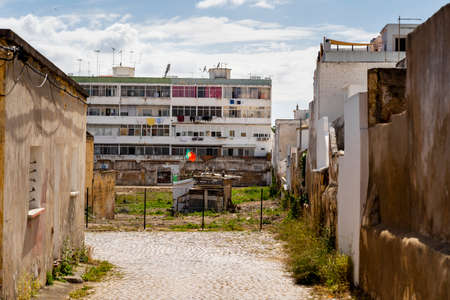 The poor neighborhood where typical architecture meets neglected block of flat in Olhao, Algarve, Portugalの写真素材