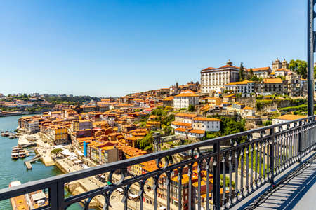Beautiful panorama of the city of Porto with famous bridge in the foreground, Portugal.の写真素材