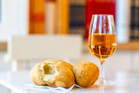 Delicious cod fish cake stuffed with cheese served in Porto, Portugalの写真素材