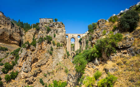 Beautiful view of historic roman bridge connecting two parts of Ronda, Spainの写真素材