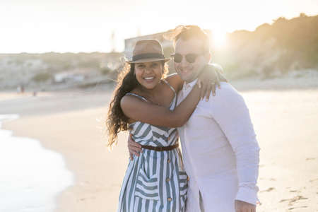 Young couple enjoying time together on the beach in Algarve, Portugalの写真素材