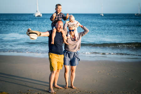 The family with two small boys enjoying time on the beach, Algarve, Portugalの写真素材