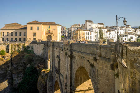 Beautiful view of historic roman bridge connecting two parts of Ronda, Spainの写真素材