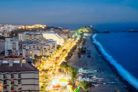 Panorama of touristic illuminated coast in Almunecar at night, Andalusia, Spainの写真素材