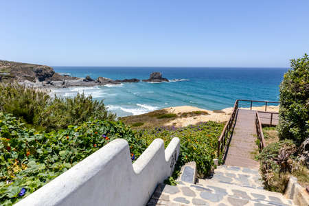 Wooden walkways by the Atlantic Ocean in Zambujeira Do Mar, Vicentina Coast Natural Park, Alentejo, Portugalの写真素材