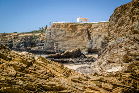 Beach with high cliffs in Zambujeira Do Mar, Vincentina Coast Natural Park, Alentejo, Portugalの写真素材