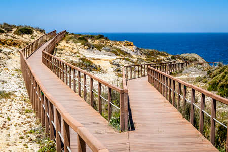 Wooden walkways by the Atlantic Ocean in Zambujeira Do Mar, Vicentina Coast Natural Park, Alentejo, Portugalの写真素材