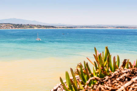 Landscape of coast and boats at Atlantic Ocean in Algarve, Portugalの写真素材