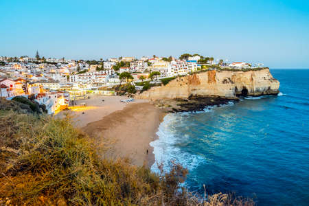 Carvoeiro cityscape with sandy beach and Atlantic Ocean in the evening, Algarve, Portugalの写真素材