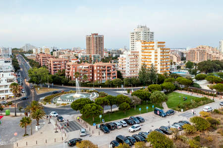 Aerial view of apartments buildings and traffic by Tres Castelos Roundabout in Portimao, ALgarve, Portugalの写真素材