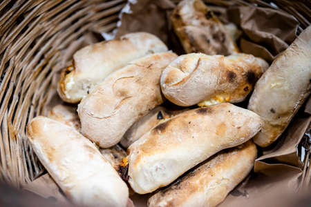 Traditional bread rolls with cheese and chorico meat baked in wood-fired oven, Faro, Portugalの写真素材