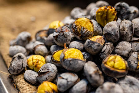 Heap of delicious chestnuts roasted on fire in Faro, Portugalの写真素材