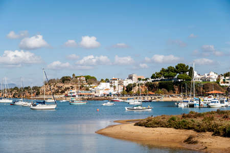 Coastal summer landscape with boats in Alvor, Algarve, Portugalの写真素材