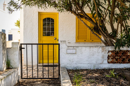 Cute small Portuguese house on Farol island in Faro District, Algarve, Portugalの写真素材