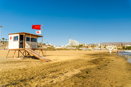 Maspalomas, Spain - December 5, 2021: Sandy English beach known as Playa das Ingles on Gran Canariaの写真素材
