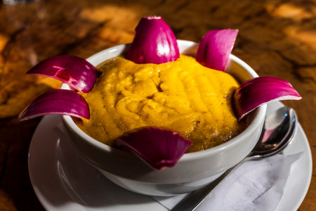Delicious traditional food from Gran Canaria called Gofio Escaldado is to be eaten with raw red onion.の写真素材