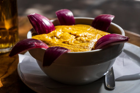 Delicious traditional food from Gran Canaria called Gofio Escaldado is to be eaten with raw red onion.の写真素材