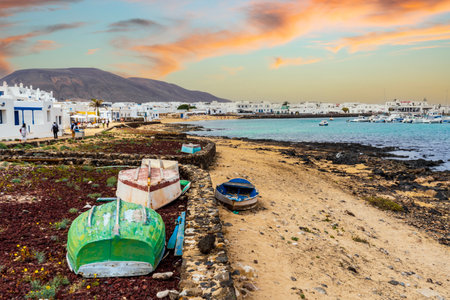 La Graciosa landscape - colorful boats on a shore and white architecture of Caleta del Sebo, Canary Islands, Spainの写真素材
