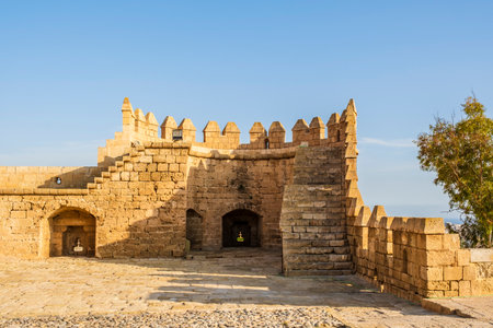 Great view of the Alcazaba of Almeria, a fortified complex in southern Spain, construction of defensive citadel with walls, towers, squares, houses and mosque. Almeria, Andalusia, Spain.の写真素材