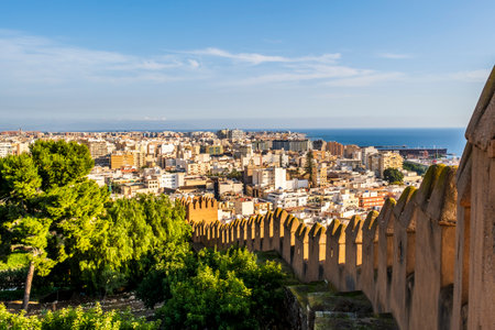 Great view of the Alcazaba of Almeria, a fortified complex in southern Spain, construction of defensive citadel with walls, towers, squares, houses and mosque. Almeria, Andalusia, Spain.の写真素材