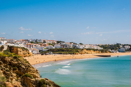Awesome view of Albufeira Beach, panoramic view, blue sky , tourist and famous place called Praia dos Pescadores or Fisherman Beach in Albufeira, Portugal.の写真素材