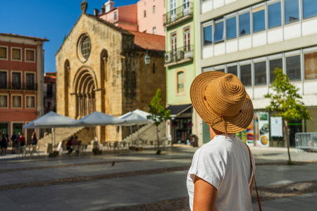 Woman sightseeing beautiful town, Coimbra, Portugalの写真素材