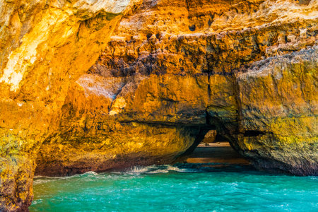 Beautiful limestone Algarve coast with caves and rock formation, Albufeira, south of Portugalの写真素材