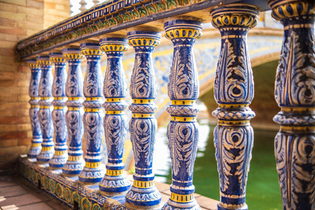 Close up of spanish tiles called azulejos on handrail at Plaza de Espana, Seville, Spain