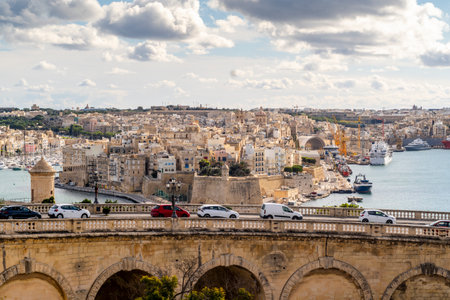 Beautiful view of bridge in capital city and historic architecture of Valletta, Maltaの写真素材