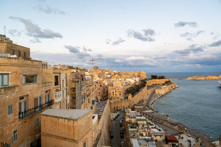 Beautiful sunset view of Valletta with a with historic houses, capital city of Maltaの写真素材