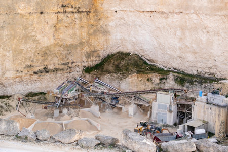 Limestone Quarry with Industrial Machinery in a Cliffside Setting, Maltaの写真素材
