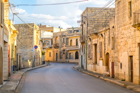 Charming street between limestone building in Nadur, Gozo island, Maltaの写真素材
