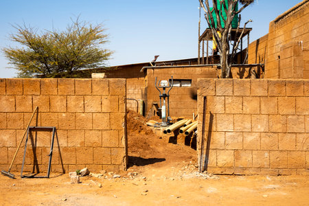 Outjo, Namibia â€“ a house under construction against the local landscape.