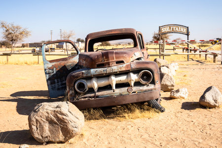 Solitaire's car graveyard in Namibia August 27, 2025: features rusted vintage cars near small desert...