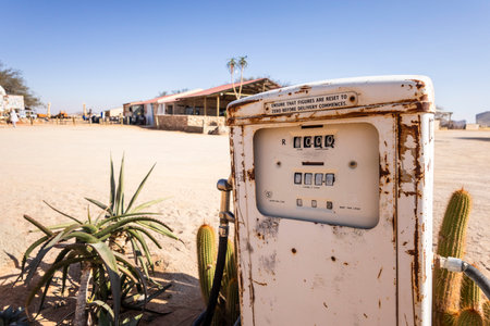 Old rusty fuel pump in Solitaire, Namibia - 27 August, 2025: set in a desert landscape with cacti,...