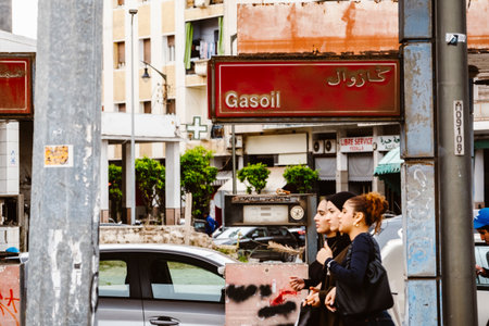 Casablanca, Morocco â April 18, 2025: Street scene in the old medina showing people walking and shopping along a lively alley with traditional architecture and arched doorways. The image captures the vibrant daily life and cultural atmosphere of this historic North African city, blending tradition and modern urban energyの写真素材