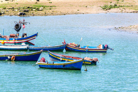 Rabat, Morocco â€“ A scenic view of the Bou Regreg River with colorful fishing boats gently...
