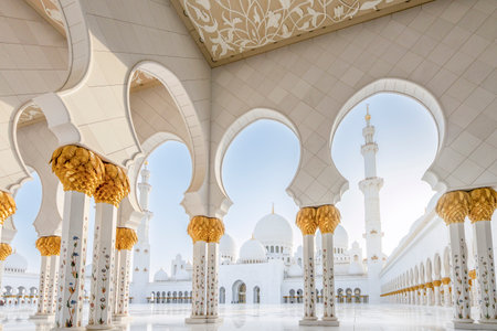 The majestic Sheikh Zayed Grand Mosque in Abu Dhabi, United Arab Emirates, featuring stunning white marble domes, elegant minarets, and intricate Islamic architecture. A symbol of Emirati heritage, faith, and cultural unity.の写真素材