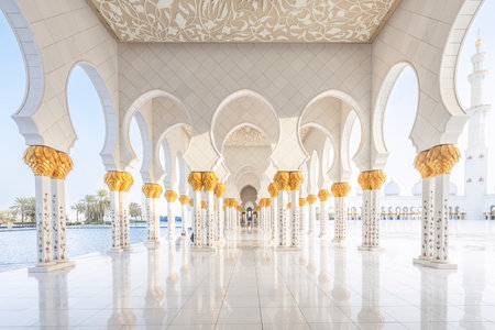 The majestic Sheikh Zayed Grand Mosque in Abu Dhabi, United Arab Emirates, featuring stunning white marble domes, elegant minarets, and intricate Islamic architecture. A symbol of Emirati heritage, faith, and cultural unity.の写真素材