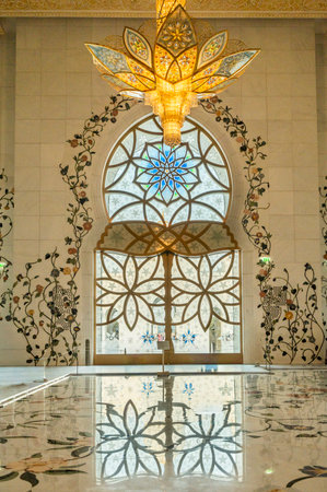 The majestic Sheikh Zayed Grand Mosque in Abu Dhabi, United Arab Emirates, featuring stunning white marble domes, elegant minarets, and intricate Islamic architecture. A symbol of Emirati heritage, faith, and cultural unity.の写真素材