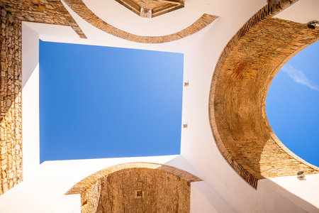 Arco do Repouso, a historic archway in Faro, Algarve, Portugal, showcasing traditional stone...