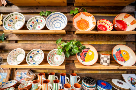 Souvenirs from Alentejo in the town of Vila Nova de Milfontes, Portugal â colorful ceramic mugs with Portuguese names, a popular gift for tourists visiting this picturesque coastal region.の写真素材