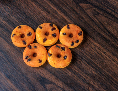 mini donut on wood backgroundの写真素材