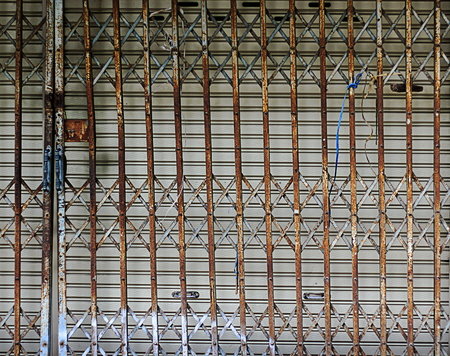 old steel door in old buildingの写真素材
