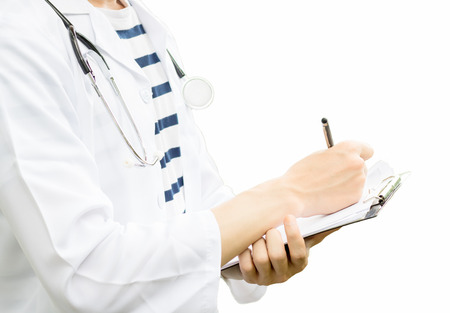 doctor working and write note in job with isolated white back groundの写真素材